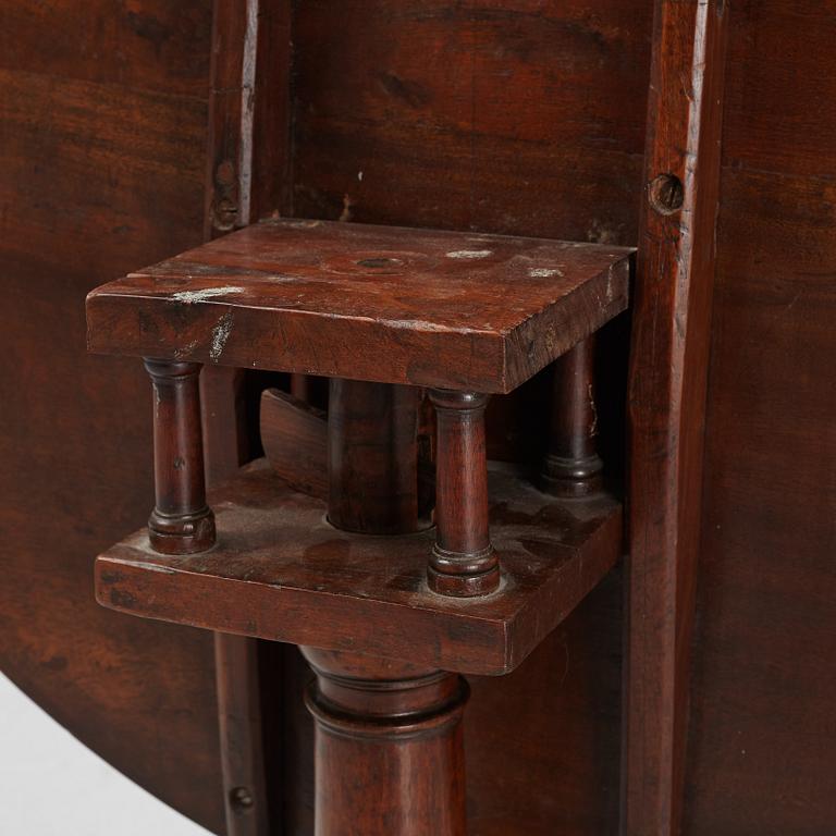 A drop-leaf table, England, 19th Century.