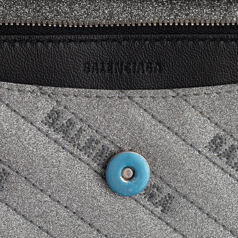 Balenciaga, a 'BB Round glitter bag'.
