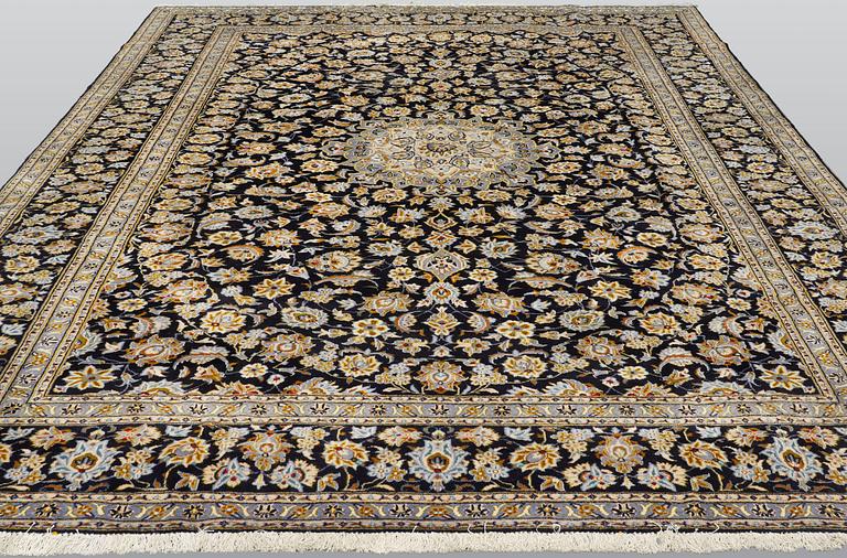 A carpet, Keshan approx. 410 x 310 cm.