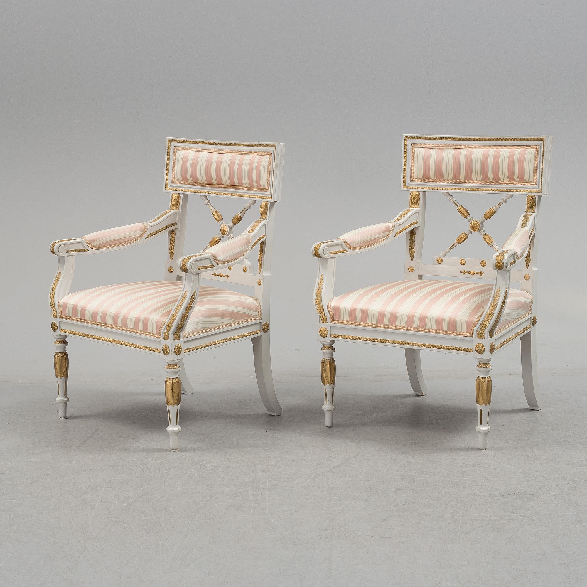 A set of two armchairs, a sofa, a stool and a chair. Early 20th century.