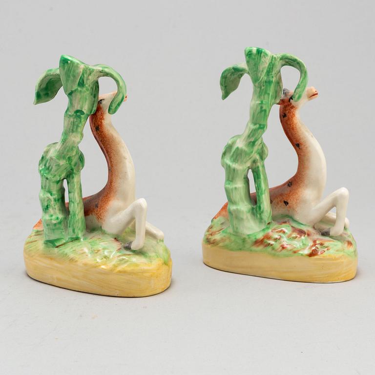 A pair of ceramic figures of giraffes, England, presumably Staffordshire, 19th century.