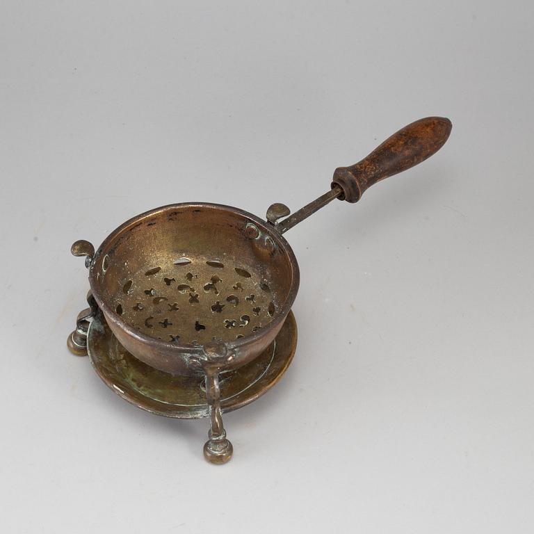 An 18th century brass brazier.