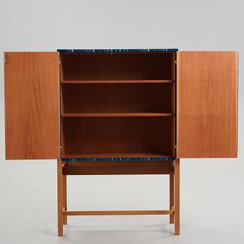 Josef Frank, a blue lacquered cabinet on stand, model nr 2192, by Svenskt Tenn, Sweden.
