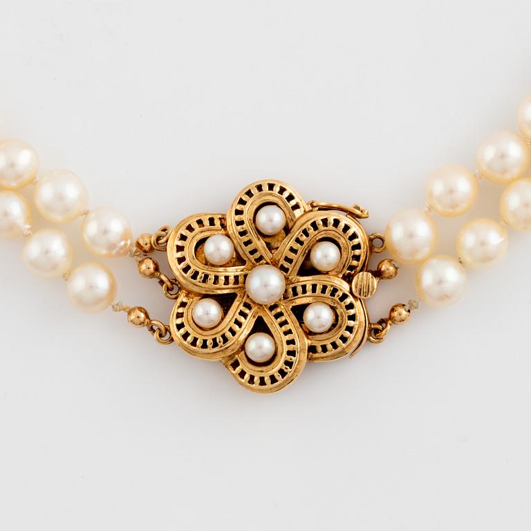 Cultured two strand pearl necklace.