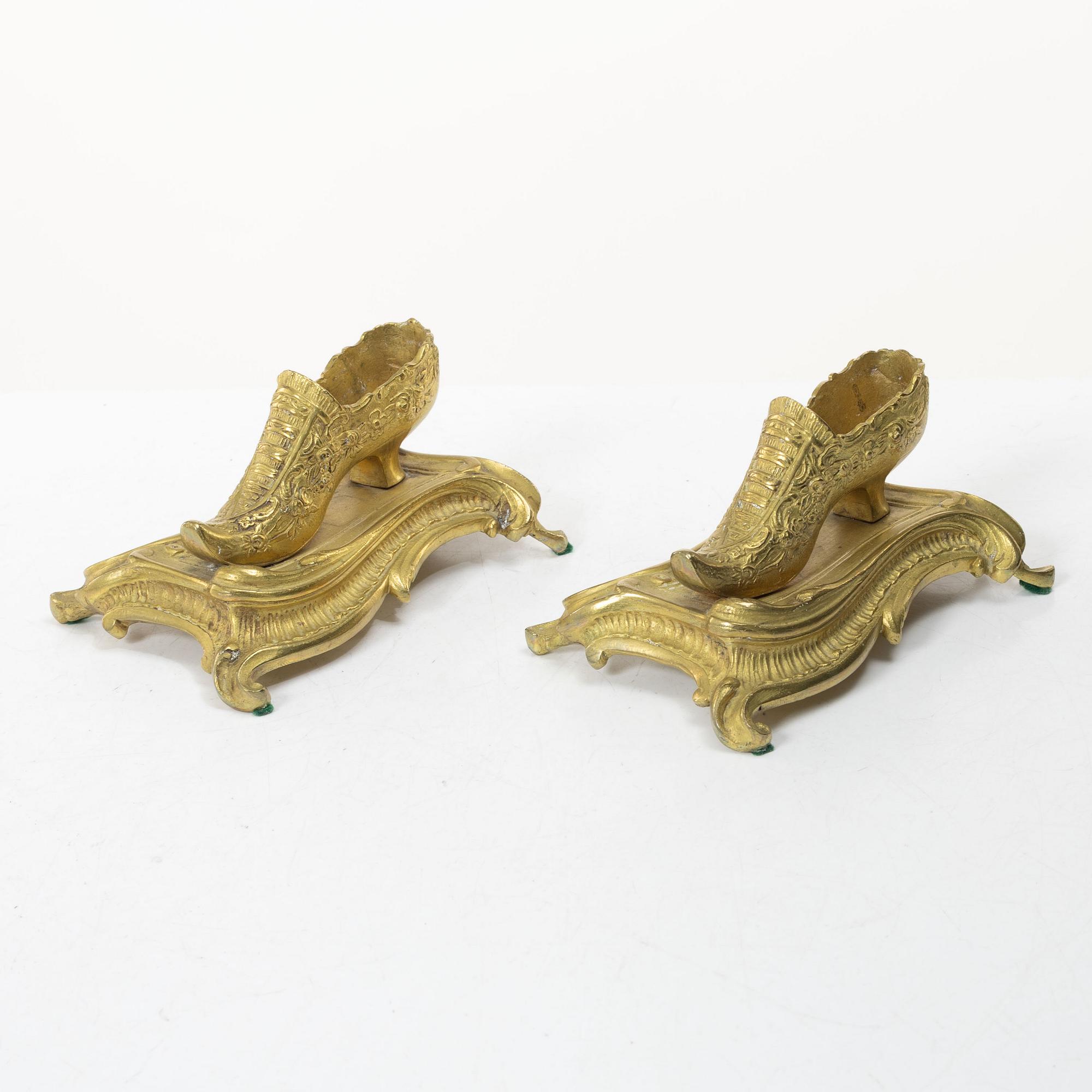 Table ornaments in the form of shoes, a pair, fire-gilt bronze, probably France, 19th century.
