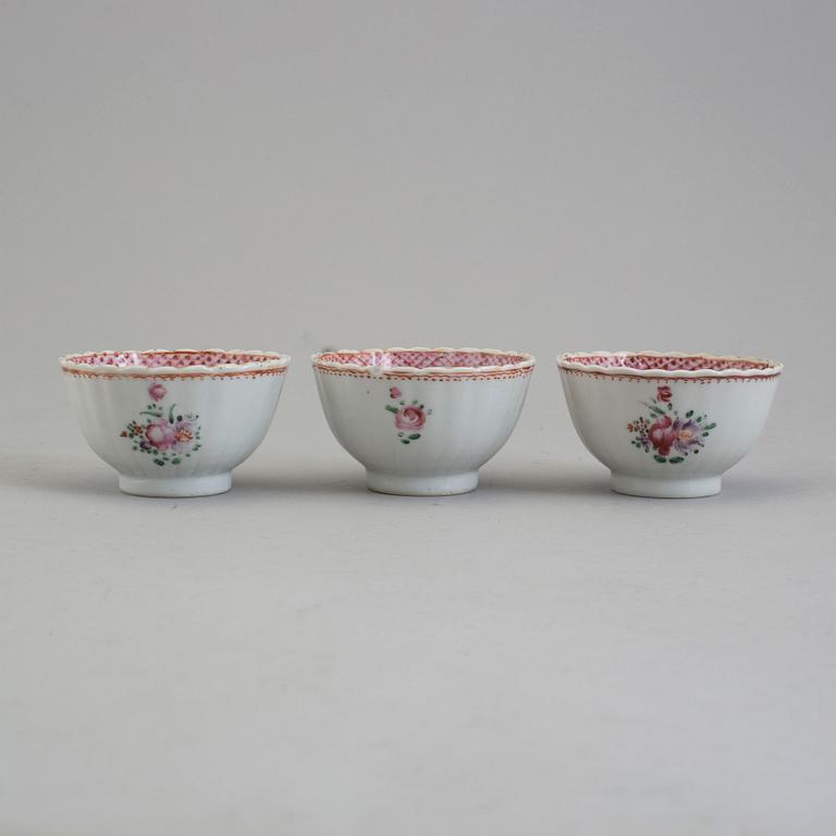 Five famille rose export porcelain cups and two dishes, Qing dynasty, 18th century.