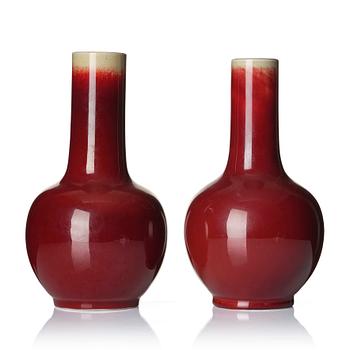 943. A set of two sang de boef glazed vases, late Qing dynasty, circa 1900.