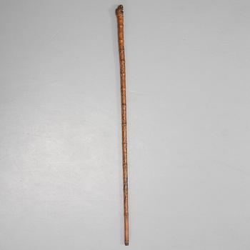 A CHINESE BAMBOO WALKING STICK, latter part of the 19th century.