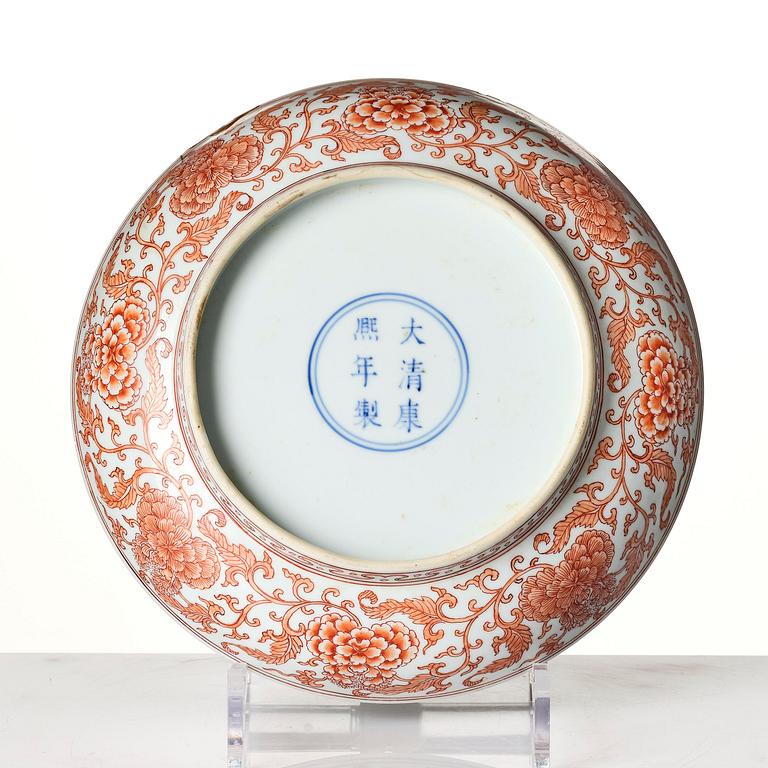 An iron red decorated 'lotus' dish, Qing dynasty, with a Kangxi six character mark and of the period (1662-1722).