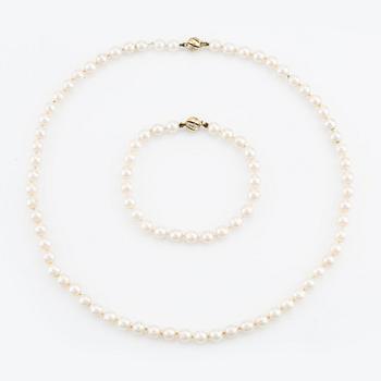 Necklace & bracelet, cultured pearls with 18K gold clasp and small diamonds.