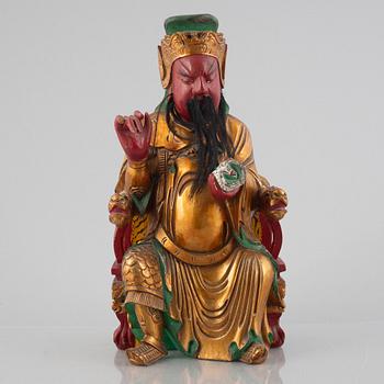 A Chinese lacquered wood figure, 20th century.