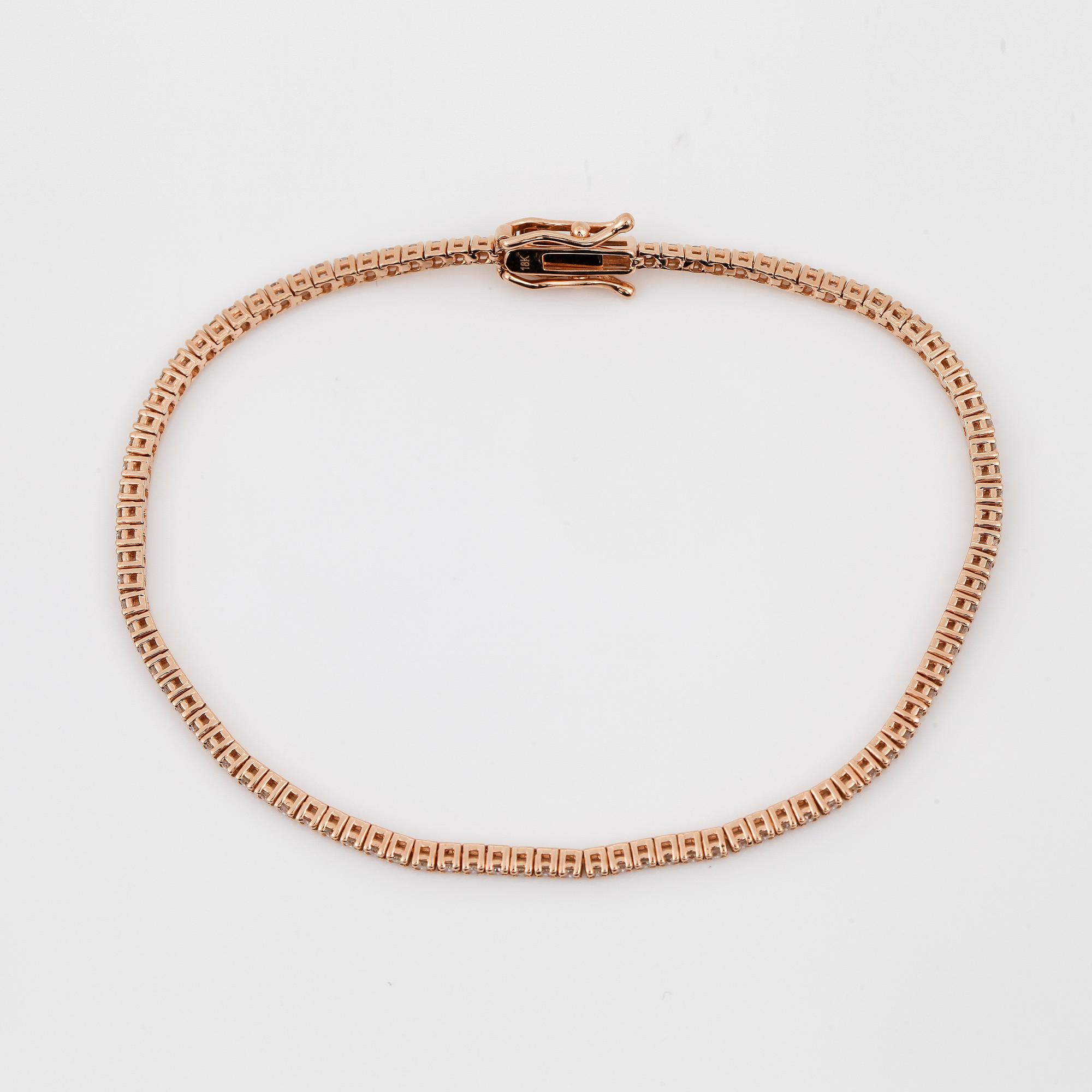 ARMBAND, ett riviére i rosa guld med briljanter, totalt ca 0.99ct.