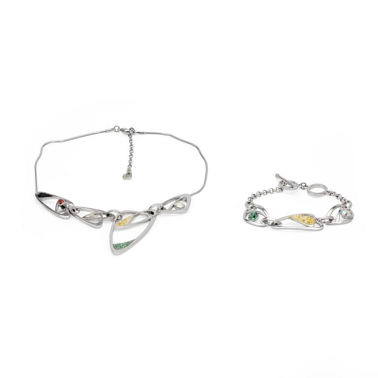 SWAROVSKI, a silver colored necklace and bracelet with swarovski crystals.