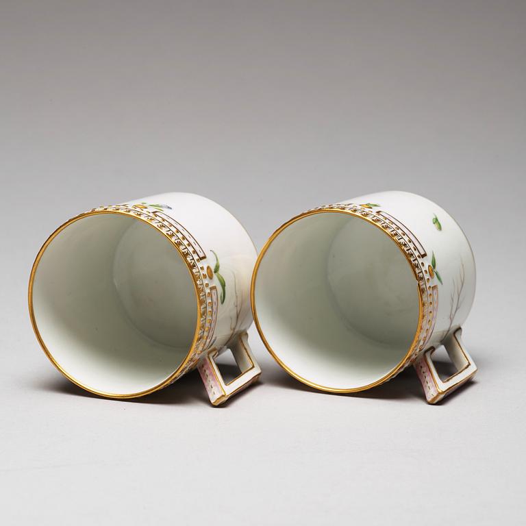 A pair of Royal Copenhagen "Flora Danica" coffee cups with stands, Denmark, 20th Century.