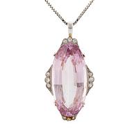 A pendant in 18K gold and platinum with a faceted kunzite.