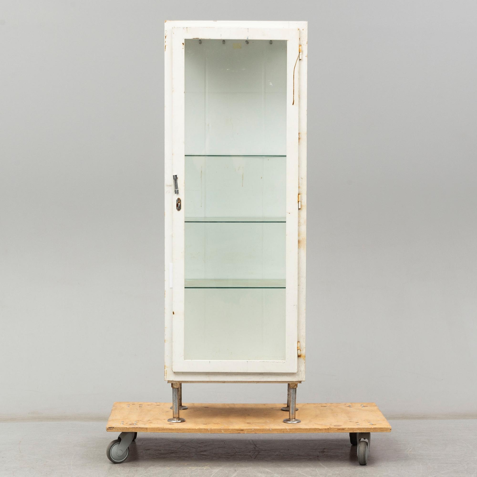 A metal doctor's cabinet, mid 20th century.