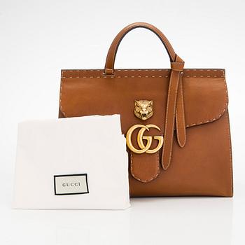 Gucci, a 'GG Marmont' leather bag.