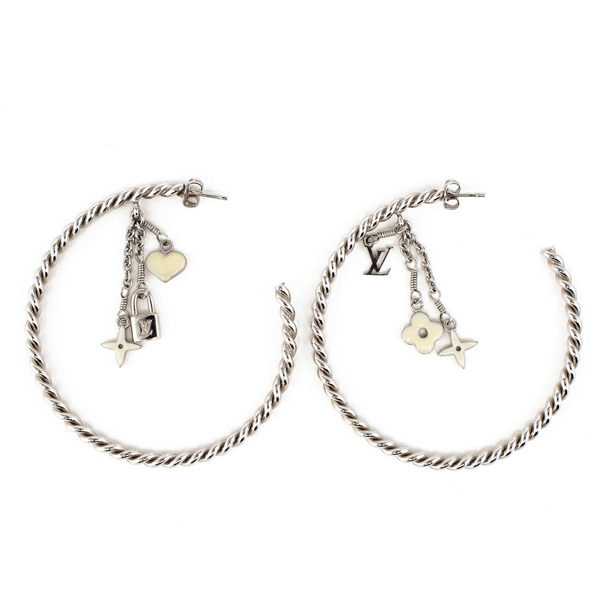 LOUIS VUITTON, a pair of charm earrings.