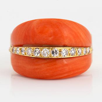 1048. An 18K gold and coral ring set with eight-cut diamonds.
