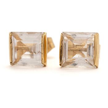 A pair of 18K gold earrings with rock crystal stones.