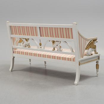 A set of two armchairs, a sofa, a stool and a chair. Early 20th century.