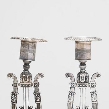 A pair of 19th-century silver candlesticks, maker's mark of Gustaf Folcker, Stockholm 1839.