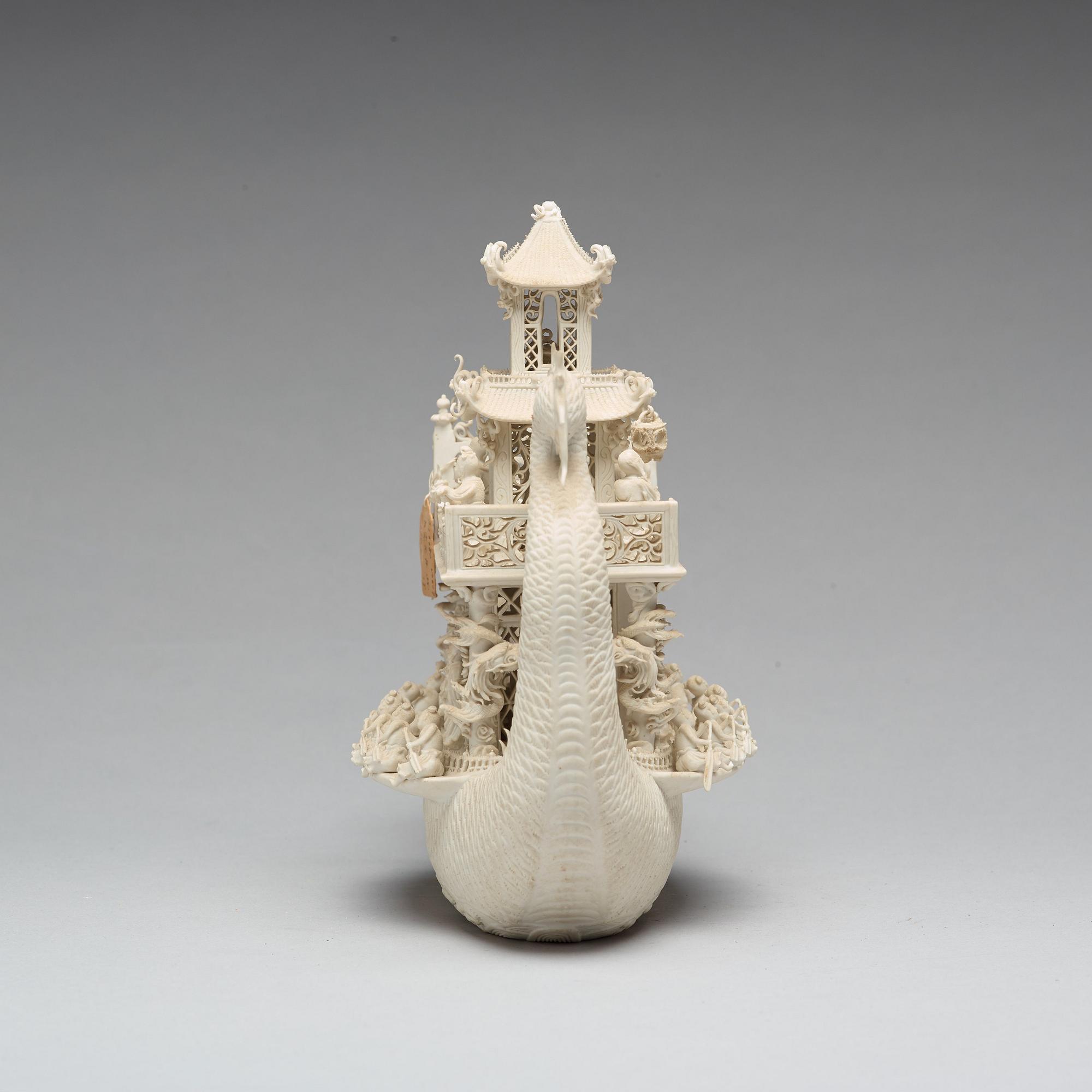 A biscuit porcelain dragon boat of 'Assembly of Immortals', Qing dynasty, Daoguang, signed Chen Guozhi, 19th century.