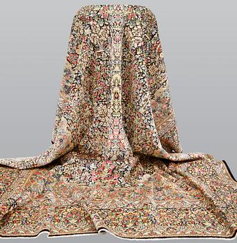 A Kirman Laver carpet, 'Millefleur', approx. 492 x 350 cm.