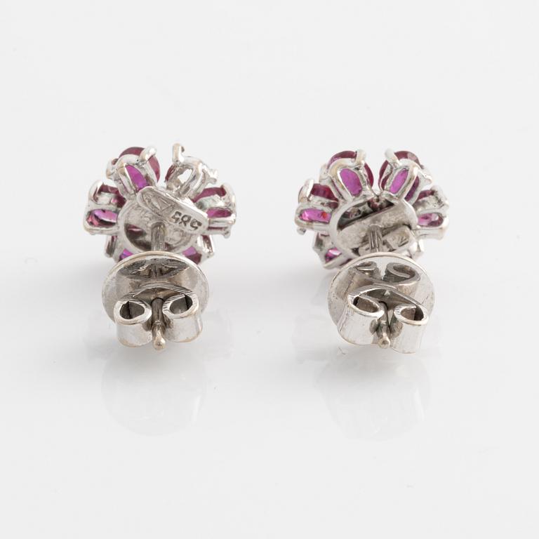 Earrings, one pair, white gold with rubies and small diamonds.