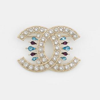 Chanel, a silvermetal, rhinestone and crystal brooch, 2019.