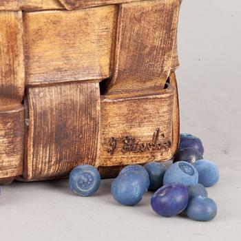 An Ingrid Herrlin stoneware blueberry basket with two lingonberries, Båstad, Sweden.