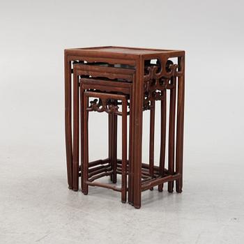 A three-piece hardwood nesting table, China, late Qing dynasty.