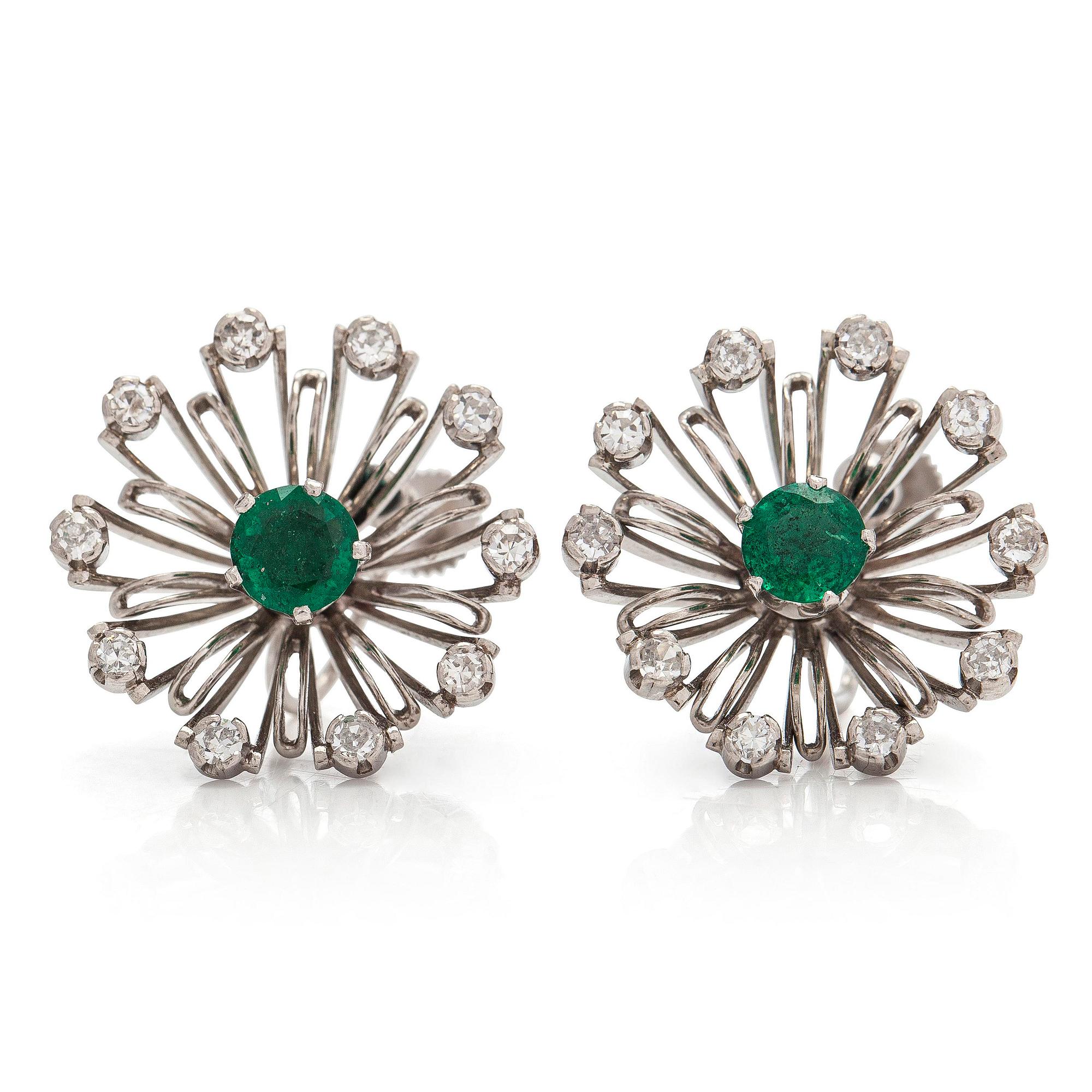 Tillander, a pair of flower earrings in platinum/palladium with octagon-cut diamonds, cultured pearls and emeralds.