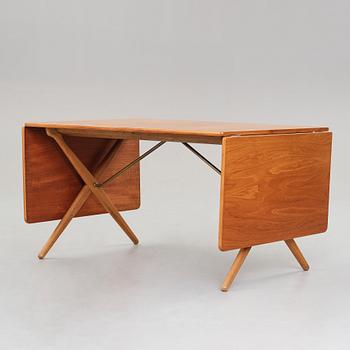 Hans J. Wegner, a teak and oak drop-leaf dining table, Andreas Tuck, Denmark 1950'-60's.
