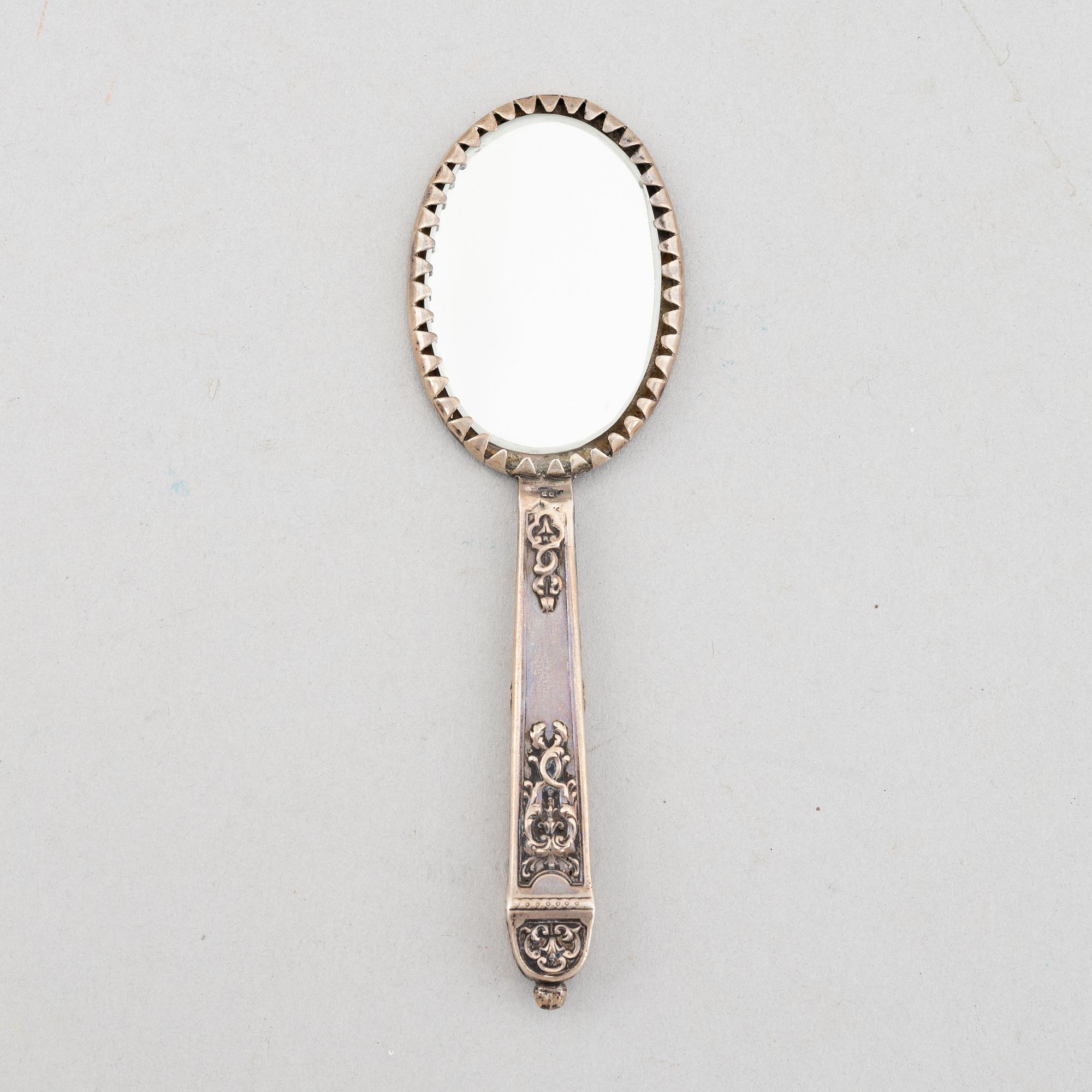 Goblet on foot, hand mirror, and box, silver.