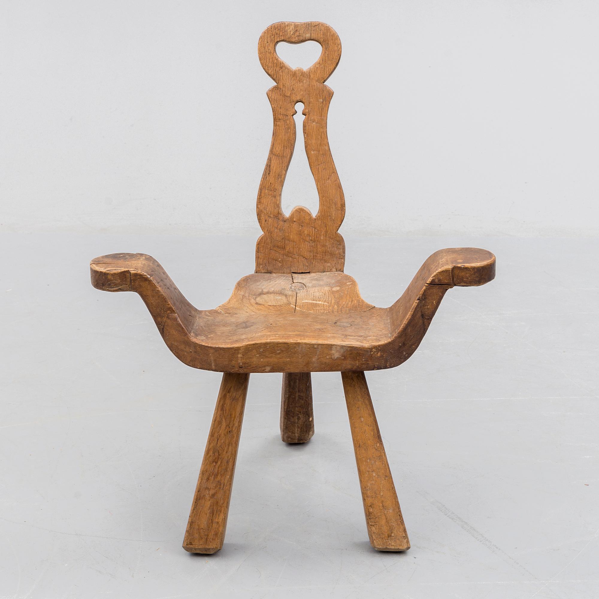 A STOOL, oak, early 20th century.