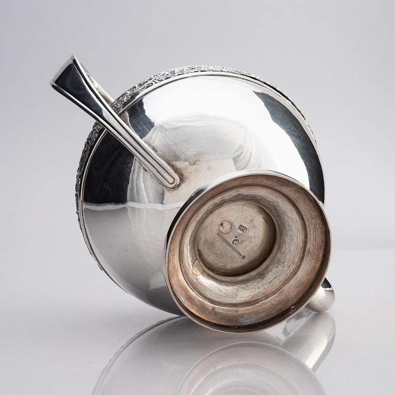 A silver pitcher with lid, unidentified maker LH, 19th century.