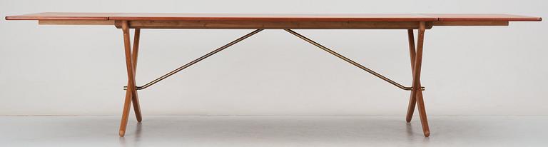 A Hans J Wegner teak and oak sabre leg dinner table by Andreas Tuck, Denmark 1950-60's.