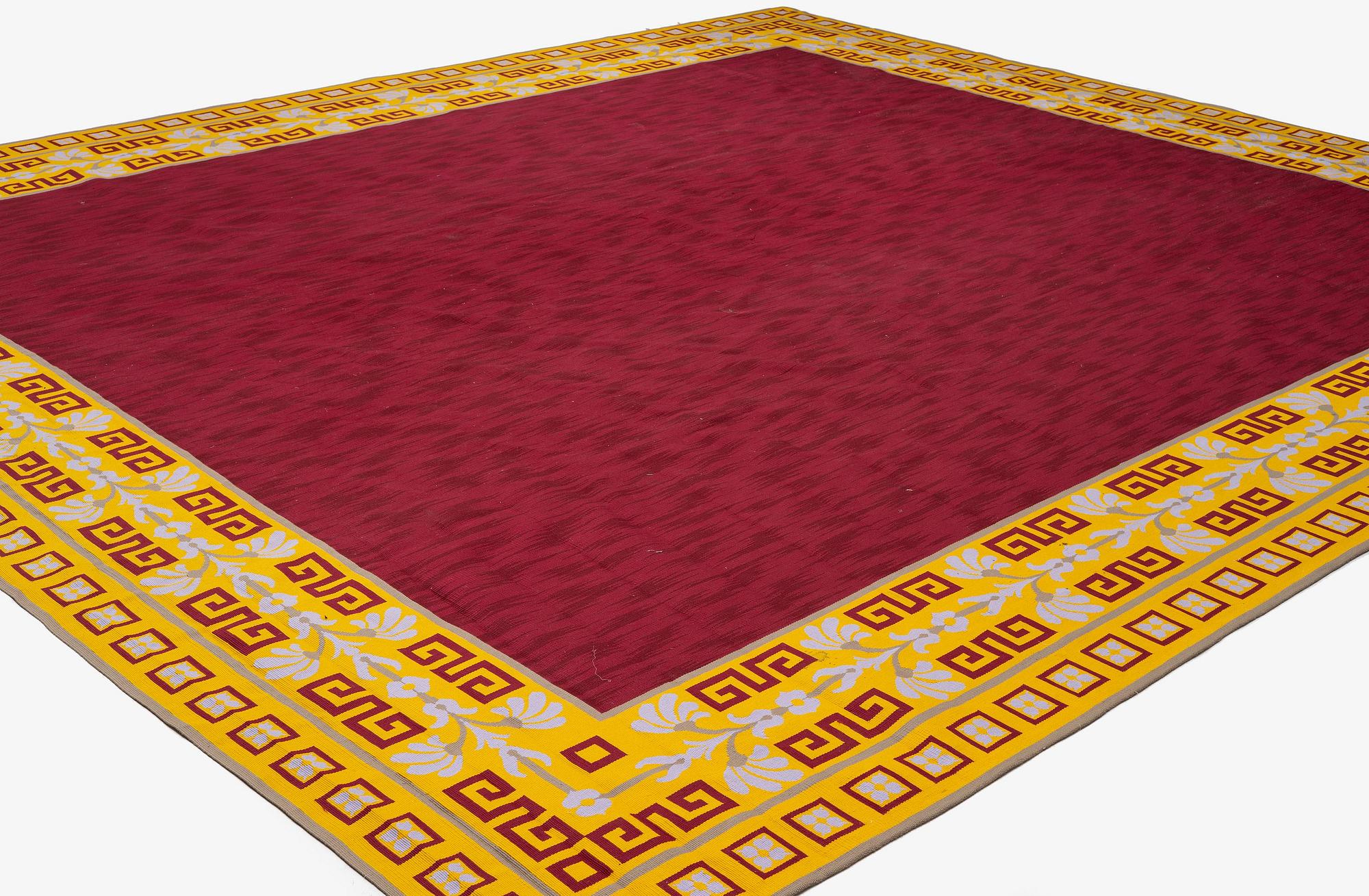 A tapestry weave carpet, c. 528 x 473 cm, signed Aubusson.