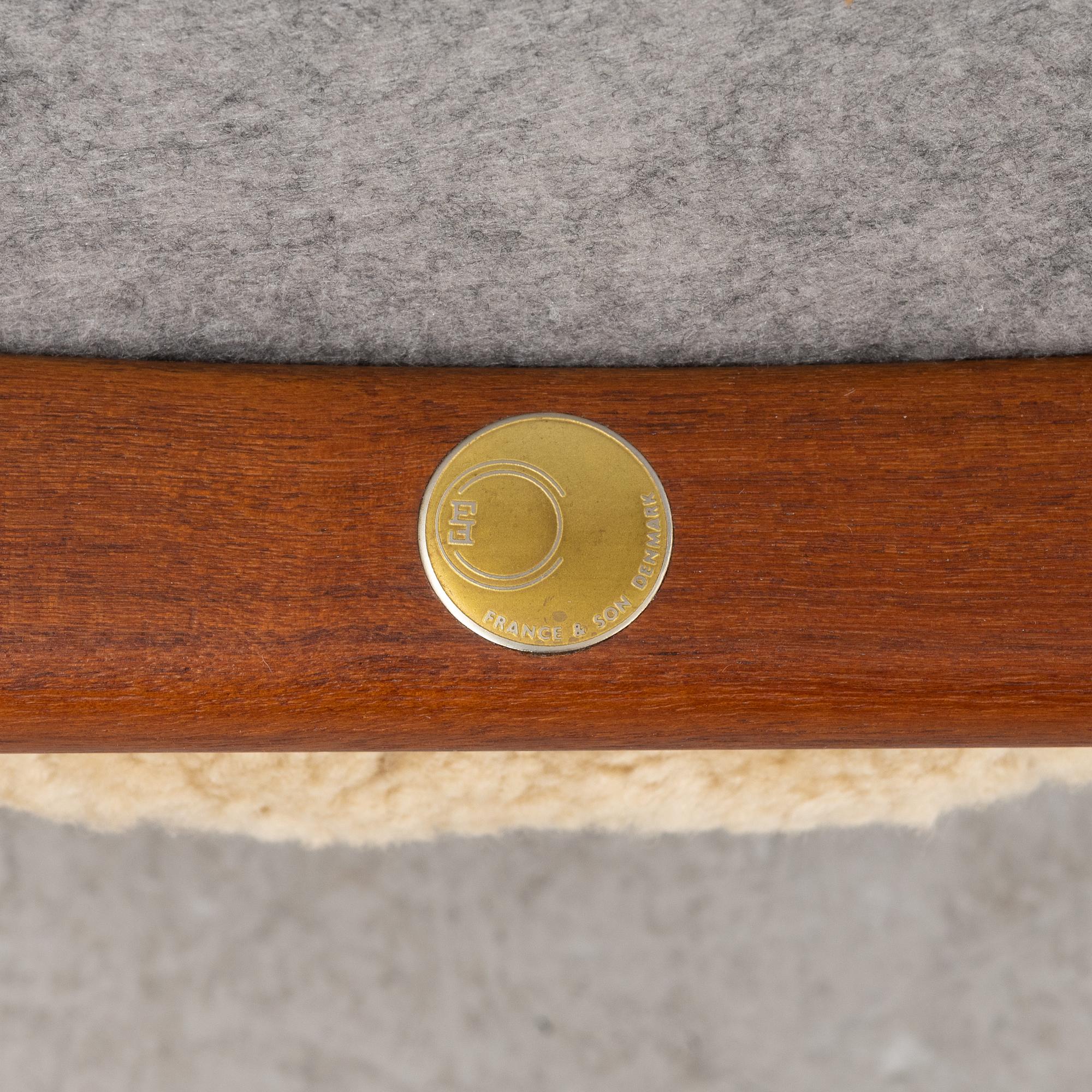 A pair of model FD 136 easy chairs with new sheepskin upholstery by Finn Juhl for France & Son, designed 1958.