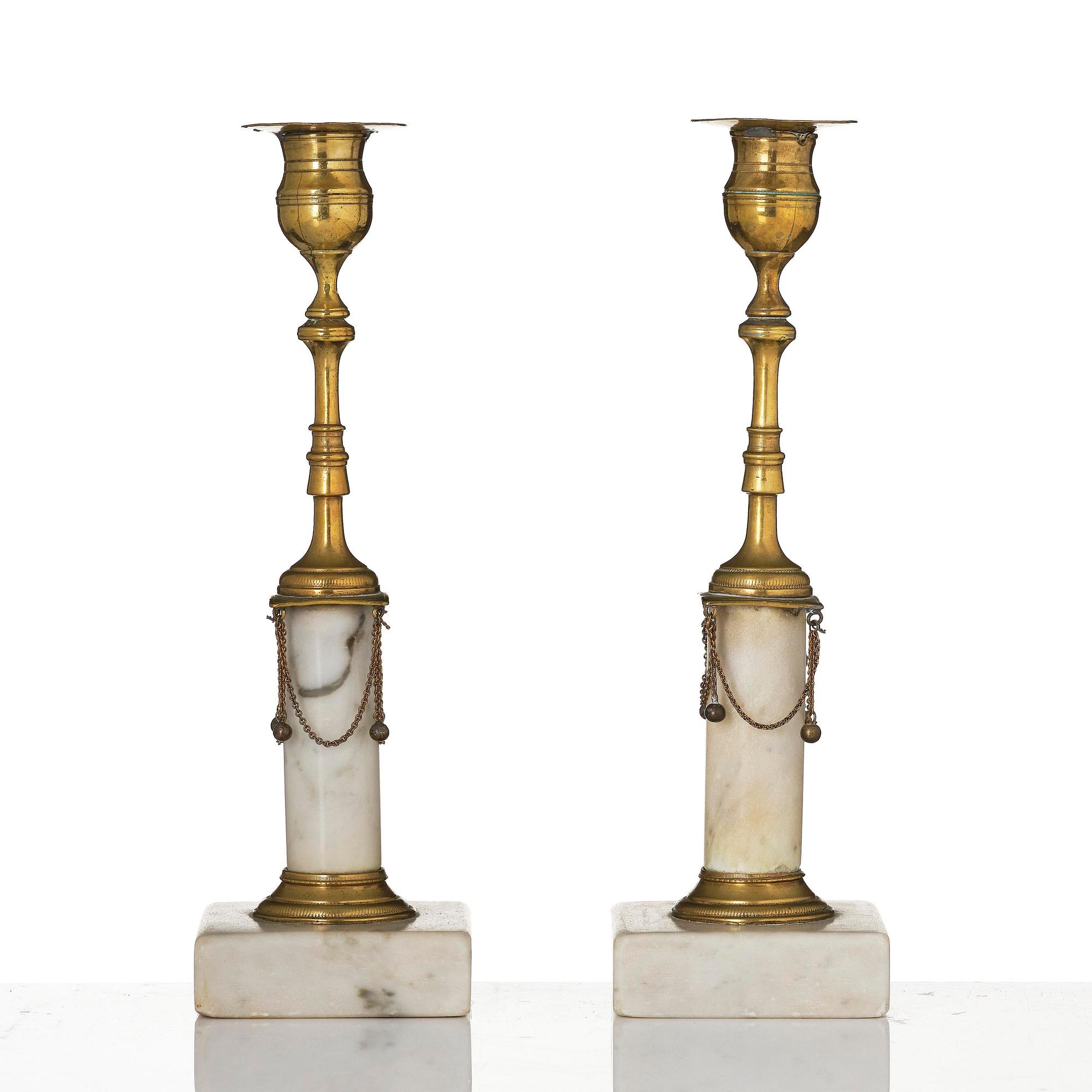 A pair of late Gustavian marble and gilt brass candlesticks, late 18th century.