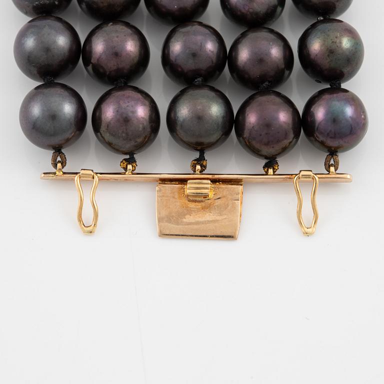 Necklace, five-row with cultured black pearls, 18K gold and white gold with brilliant-cut diamonds.