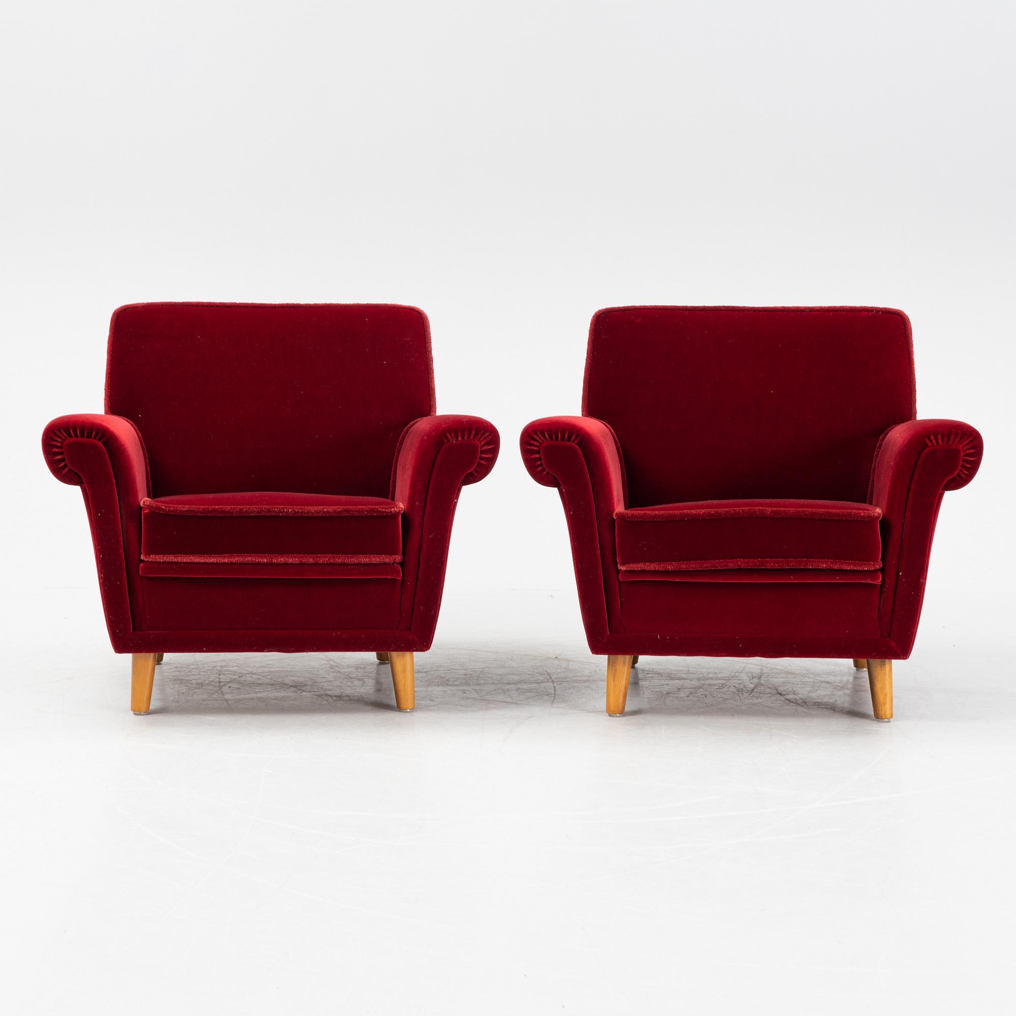 A pair of velvet upholstered easy chairs, mid 20th Century.