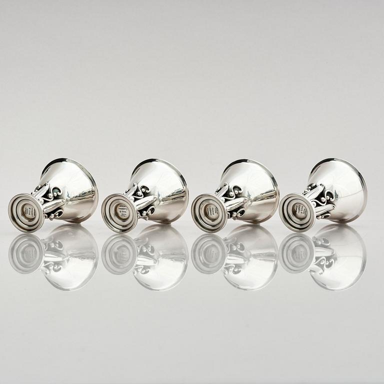 Evald Nielsen, four sterling silver beakers/cups on a foot, Denmark 20th century.
