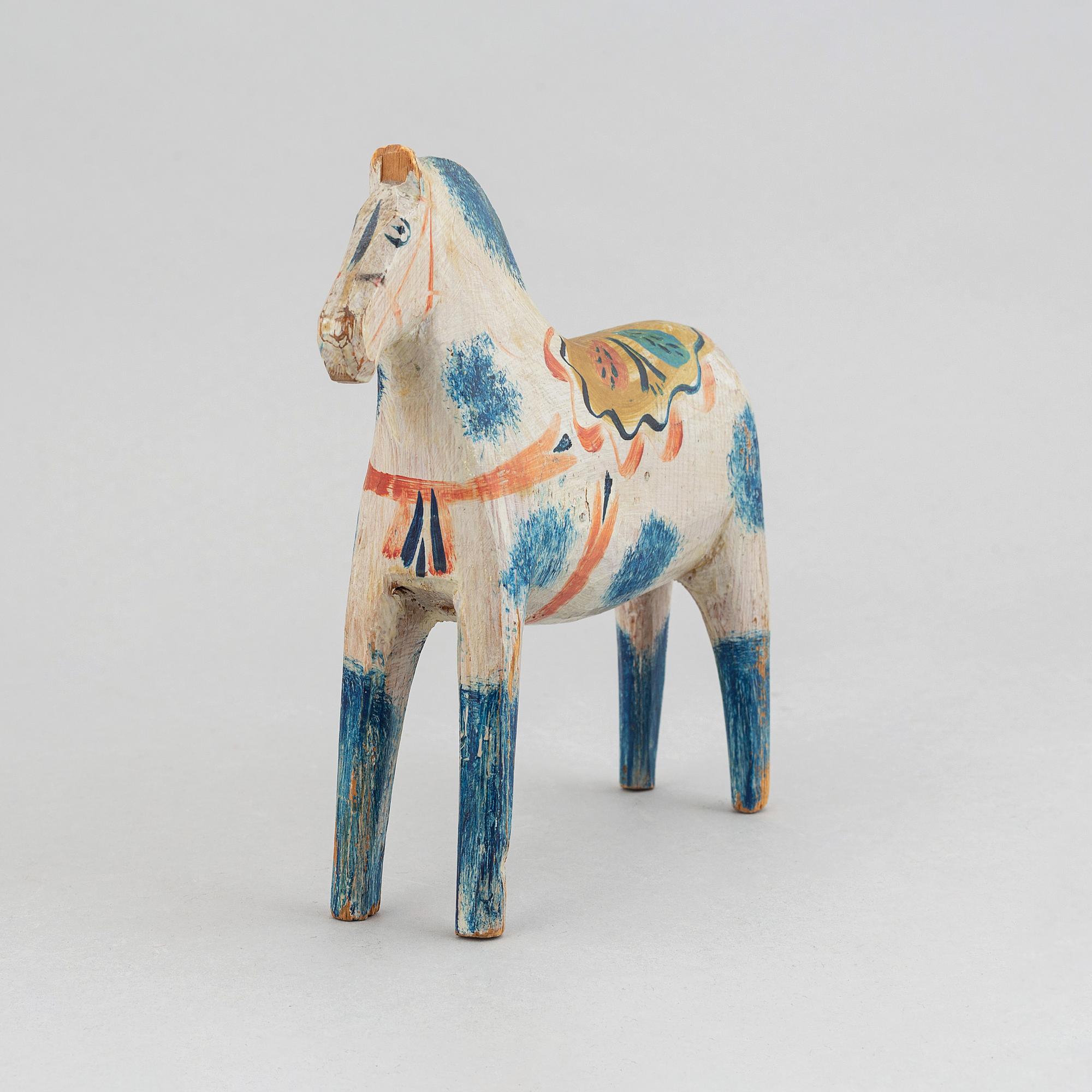 A wooden carved and painted 'Dalahäst', early or mid 20th century.