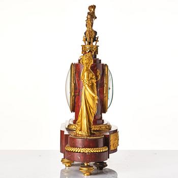 A French Empire 19th century gilt bronze mantel clock signed Lamiral.