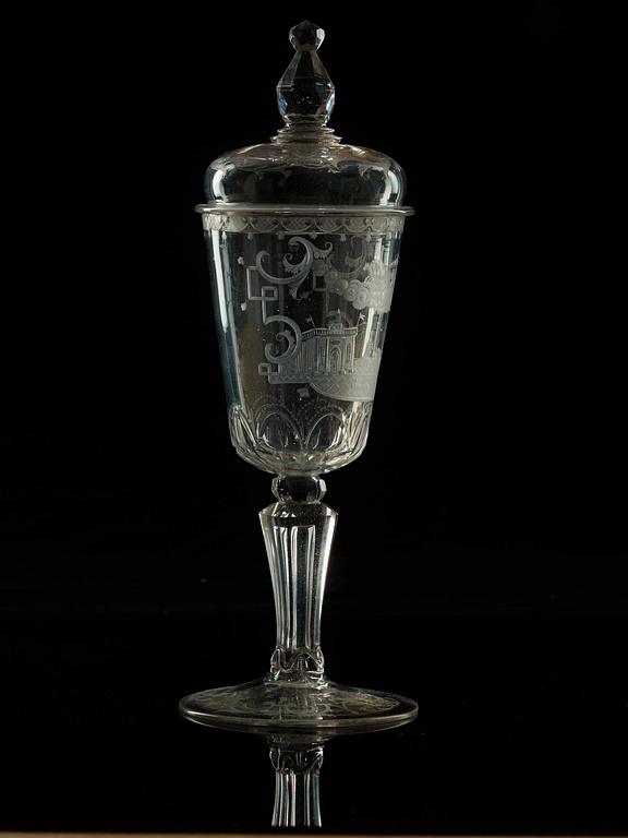 A cut and engraved glass goblet with cover, 18th Century.