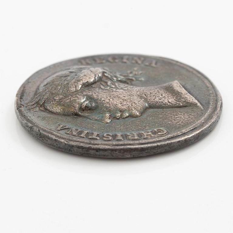 Kastpenning, Drottning Kristinas kröning 1650, av Erich Parise (medaljgravör under 1600-talets mitt).