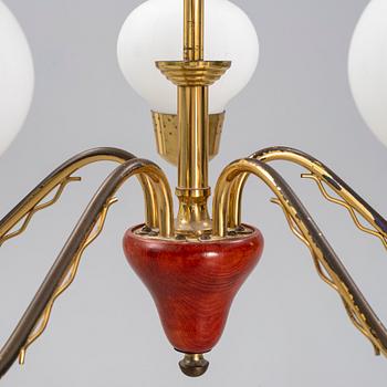 A 1950's glass and brass ceiling light.