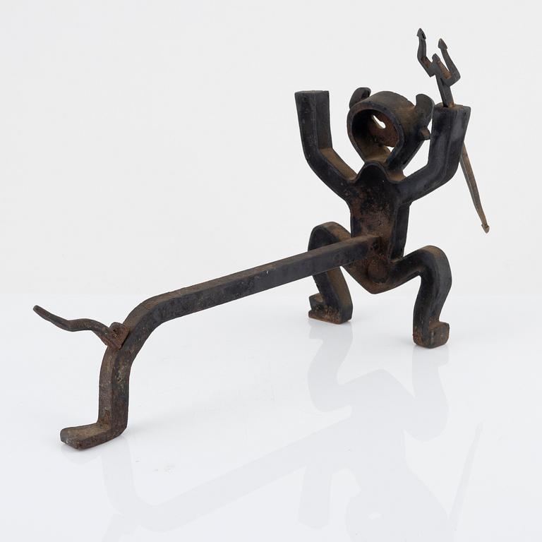 A cast iron fire dog by Eskil Björklund, second half of the 20th century.